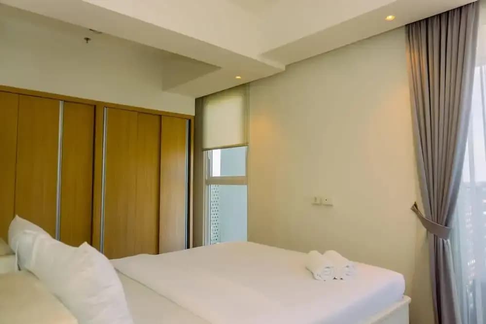 Spacious 1BR with Japandi Design at West Vista Apartment By Travelio - main photo