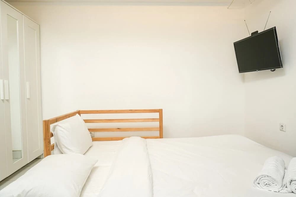 Simply White and Compact Studio at Amethyst Apartment - photo 1