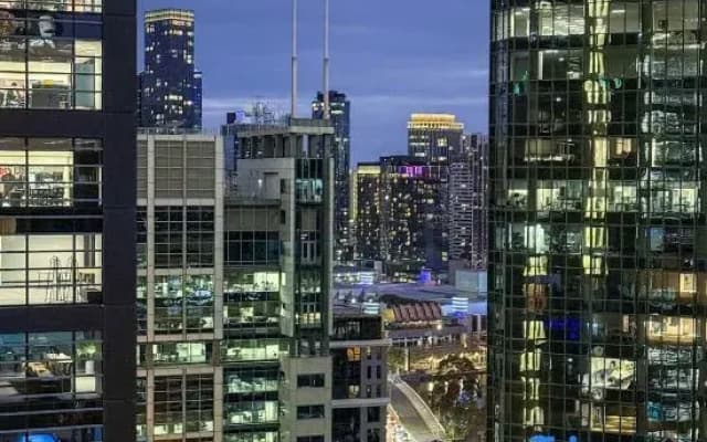 Collins Street 1BR Wake Up to Stunning City View - photo 3