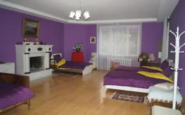peaceful yellow hostel with garden - photo 2