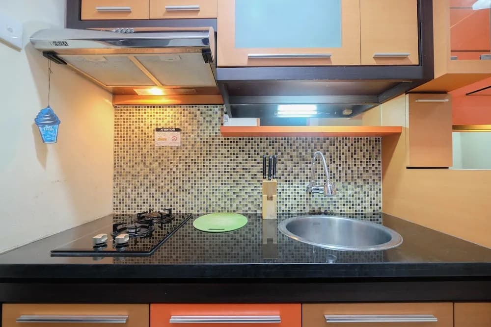 Homey and Nice Studio at Tamansari Sudirman Apartment - photo 12